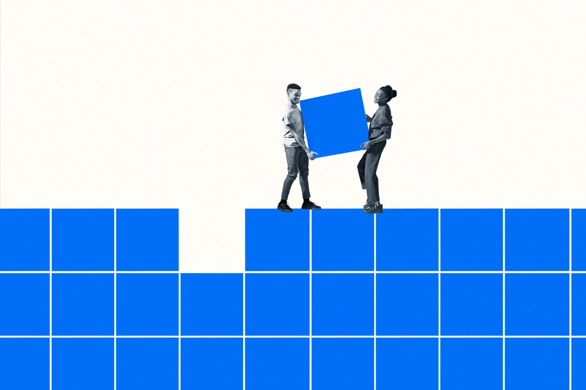 Man and woman work together to move a blue block.